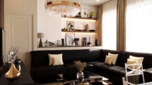 Livingroom decor with dark wall shelves, ambient LED lighting, and neutral-toned accessories on a white panel background.